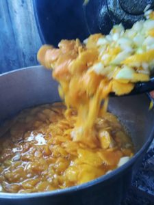 mango-and-onion-into-pot-on-fire